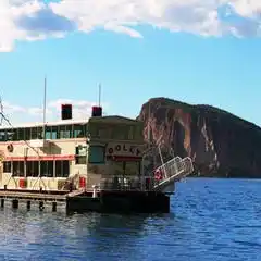 a small boat in a large body of water